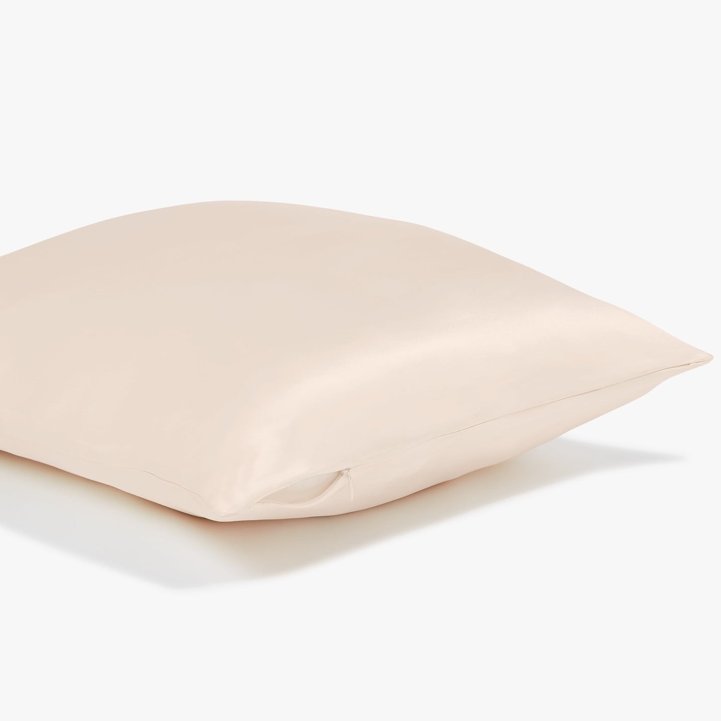 Side view of a beige pillowcase showing the sturdy zipper on the side of the pillowcase