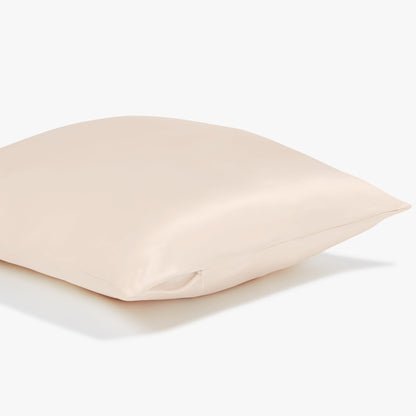 Side view of a beige pillowcase showing the sturdy zipper on the side of the pillowcase