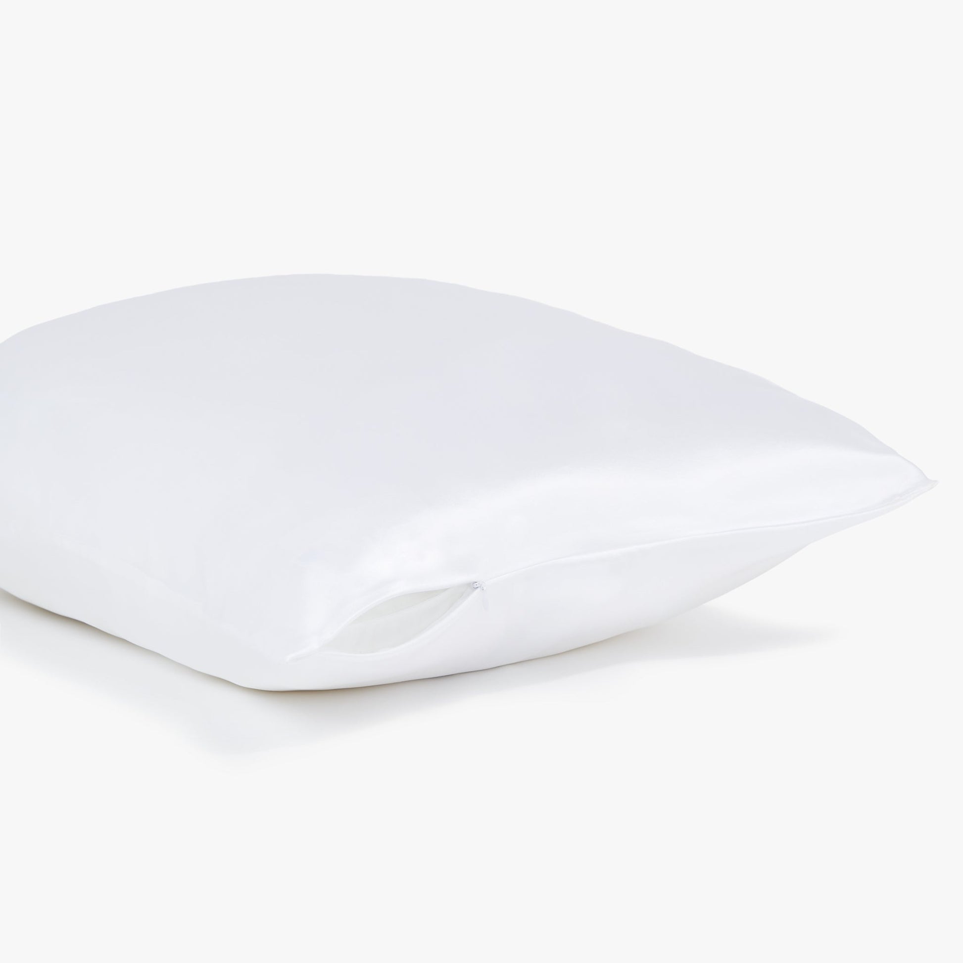 Side view of the white Silk pillowcase from Dore and Rose showing the zipper